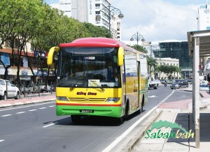 One of the shiny Kota Kinabalu City Buses that will get you around town for cheap.